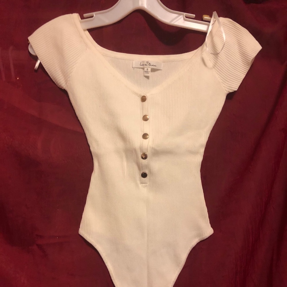 White off the shoulder or boat neck bodysuit.